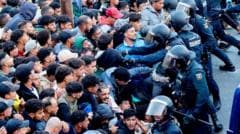 Police Fire Warning Shots Amid Migrant Relocation at Ceuta Beaches