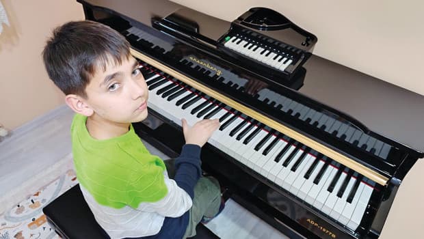 Young Musical Prodigy Transforms from Toy Piano to Recitals
