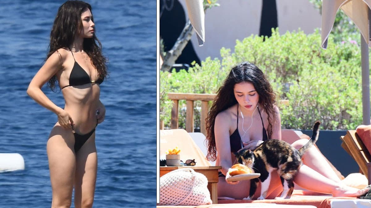 Turkish Woman Welcomes Stray Cat While Sunbathing on the Beach
